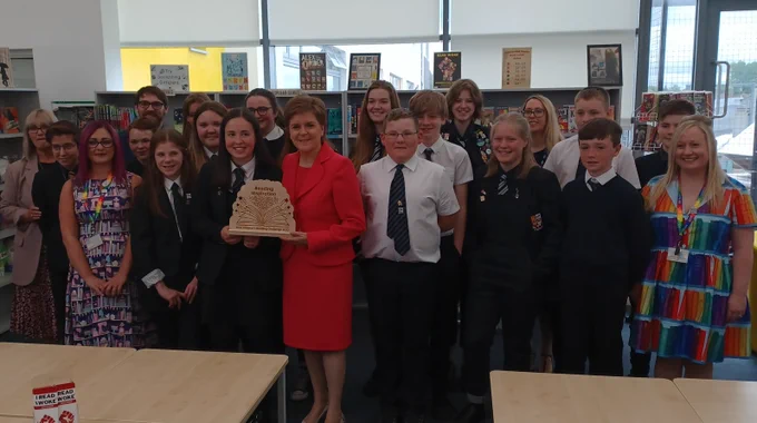 First Minister Nicola Sturgeon presents the national Reading Inspiration Award to pupils and staff from Prestwick Academy as part of the 2022 First Minister's Reading Challenge.