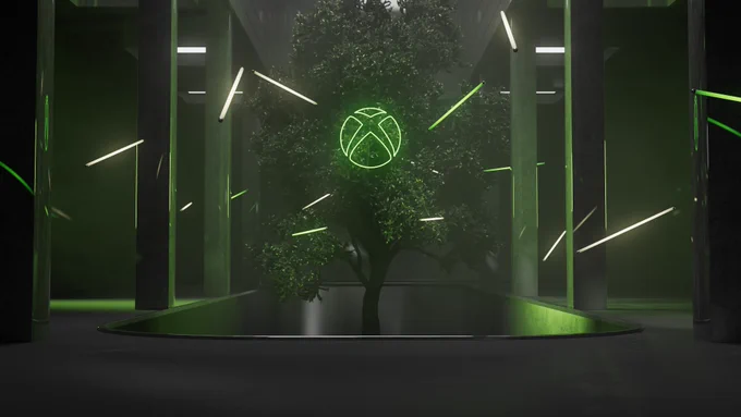 An image of a neon green Xbox logo over a tree in a modern industrial setting