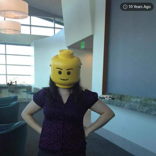 Emily Barney wearing a Lego minfig head mask at CALIcon 2012 in San Diego