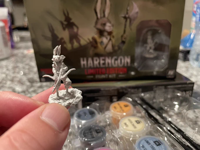 Harengon limited edition mini figure bipedal hare/rabbit holding a bow with paints. In the back