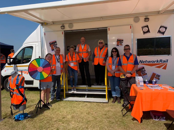 PASMA and Network Rail team standing outside Wales and Western community safety vehicle.