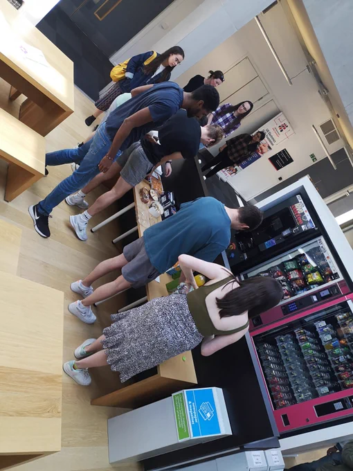Queueing for cake at 'debate and cake'