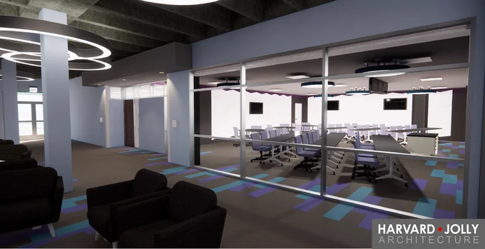 A computer rendering of a classroom behind glass windows. Six long tables set up in a V formation with purple chairs face the front of the room. Outside of the classroom, black lounge chairs fill the lobby.