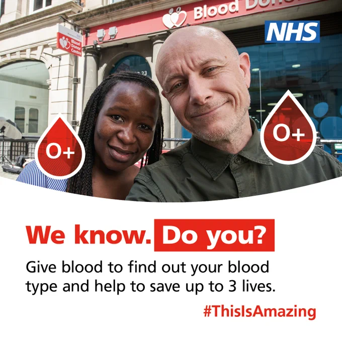 Two blood donors are stood in front of a blood donor centre. Their blood types appear next to them in a blood drop, O . Underneath is text which says 'We know. Do you? Give blood and find out your blood type and help to save up to 3 lives.'