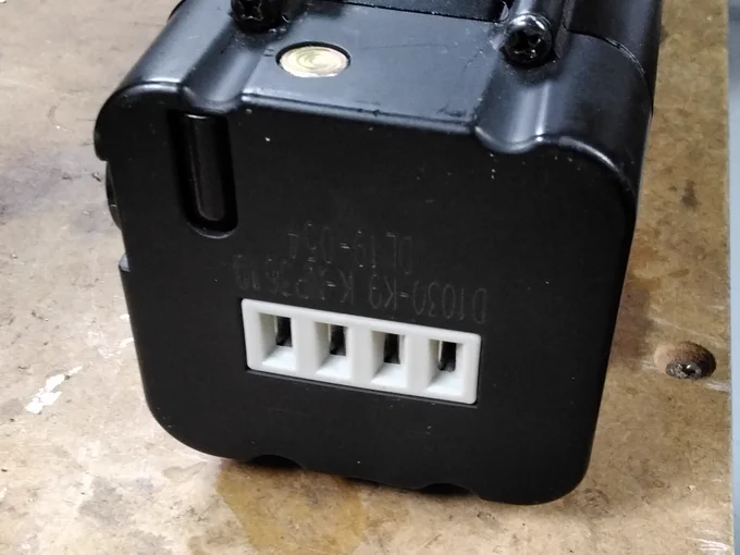 A 4-pin 'blade socket' connector on the end of an eBike battery.