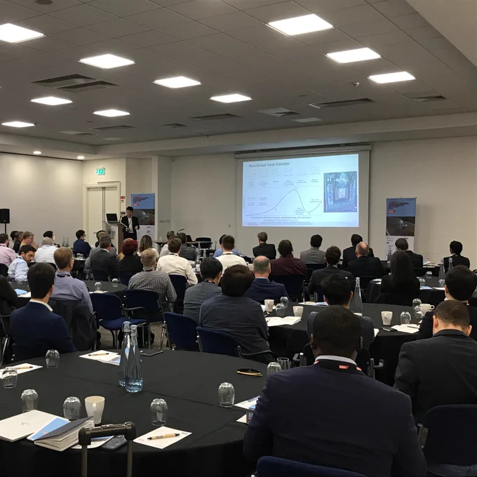 Dr Billy Wu addresses the delegates of the Vehicle Thermal Management Systems conference inside the British Motor Museum in Gaydon.