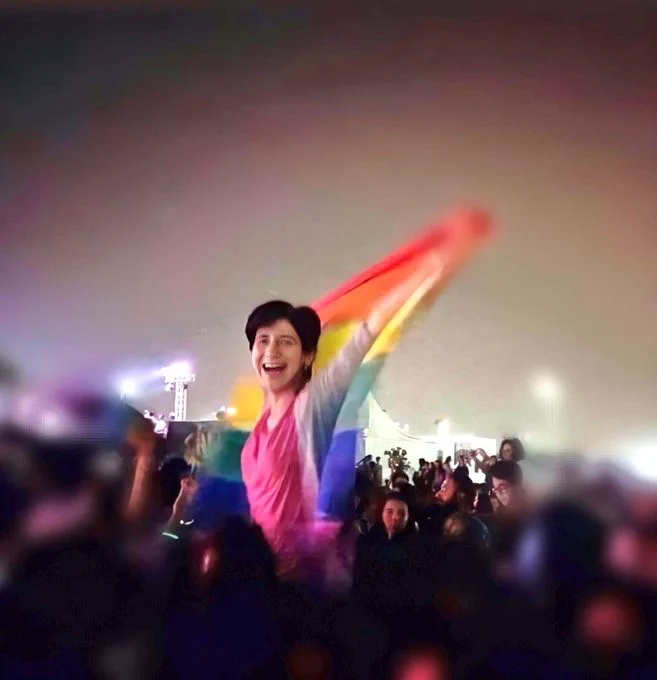 Sarah Hegazi with a rainbow flag