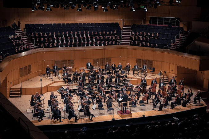The orchestra and RSNO Chorus on the concert hall stage.