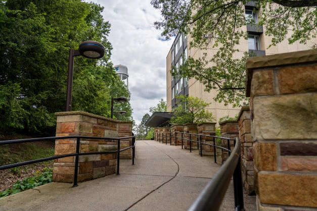 Winding walkway leading to Allen Hall entrance. WVU water tower in background