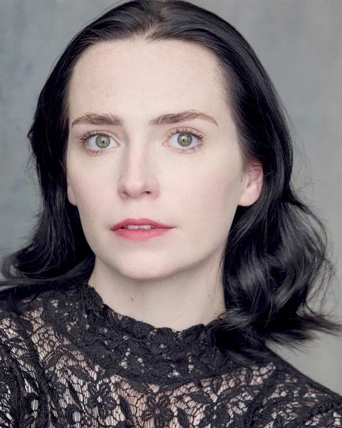 Headshot style photo of an actor.