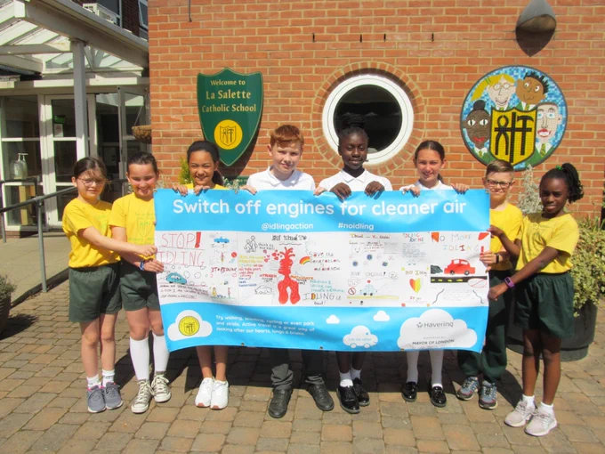 pupils from Havering school holding banner supporting anti-idling campaign 