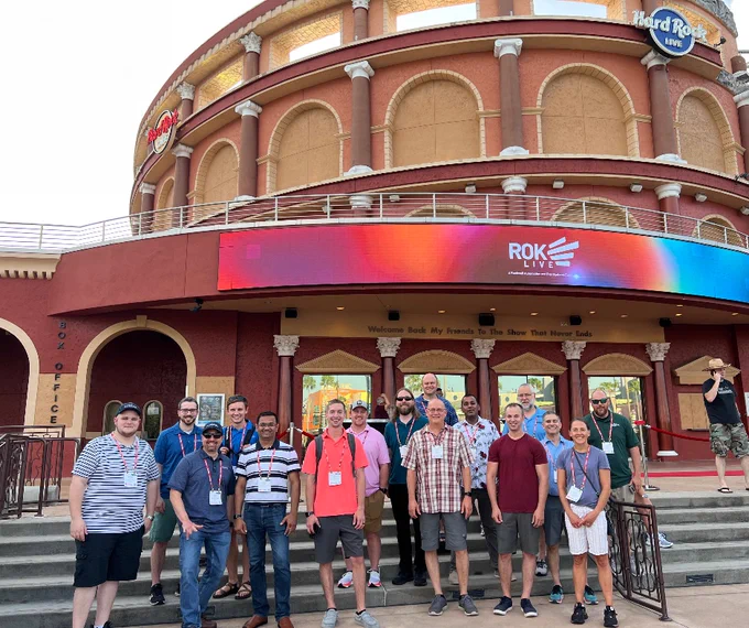 Our group took a photo in front of the Hard Rock Hotel underneath a LED sign that has the ROKLive logo.