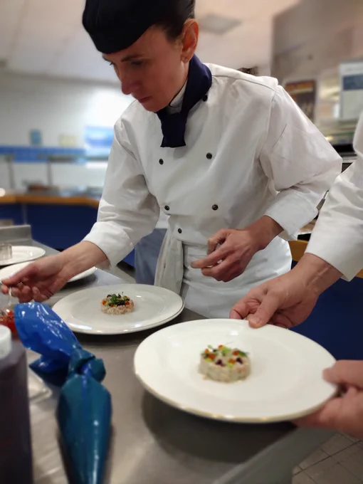 Image shows a chef preparing food.