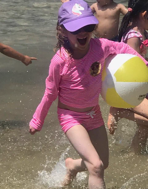 A child playing in the water.