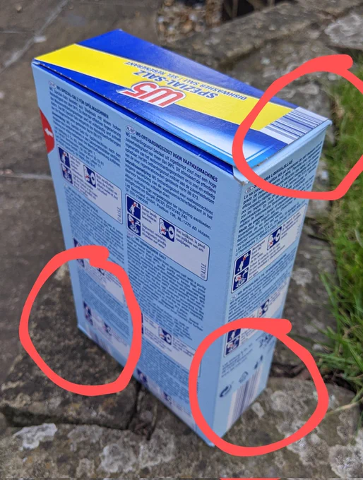 A packet of Lidl W5 dishwasher salt with barcodes on top, back and sides. The barcode positions have been circled with red lines to point out where they are.
