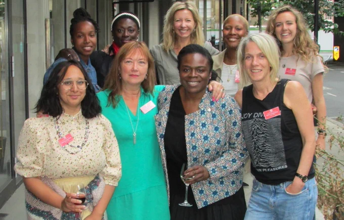 Group of women and non-binary people smiling for a group photo: 
Left to Right: Fozia Khaliq, Cherish Oteka, Afia Nkrumah, Jo Tracy, Libby Potter, Lidz-Ama Appiah, Liv Little, Zoe Dobson, Lowri Roberts