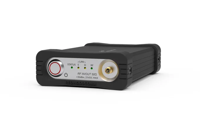 Front view of RWC5021P personal LoRaWAN device tester, showing power button, SMA(F) connector for RF, and status lights.
