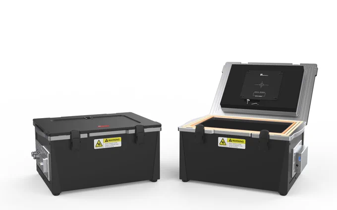 Two RWC7001A RF Shielding Enclosures. The one at left is closed, showing the cover latches and RF ports. The one at right is open, showing the triple gasket the RF isolation, and the optional antenna in the lid.