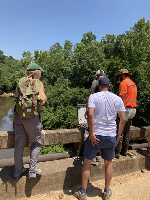 Holden Smith speaks to students on bridge over North River. Photo by Rebecca Maloy (USGS).