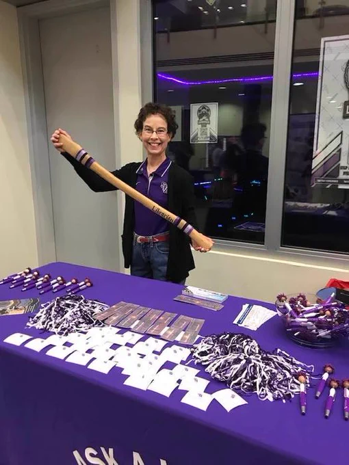 Librarian holding axe handle