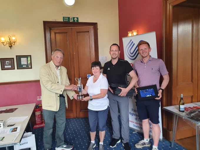 Chairman Sandy Sutherland presents Scottish Swimming with the Peebles Cup after they won the SportsAid Scotland Charity Golf Classic at Ratho Park.