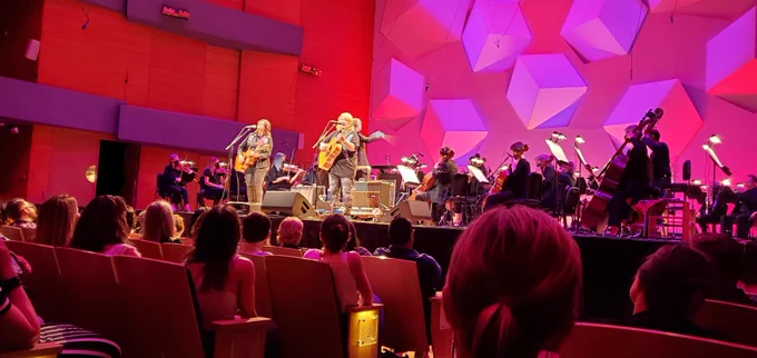 The Indigo Girls on stage with the Minnesota Orchestra. 