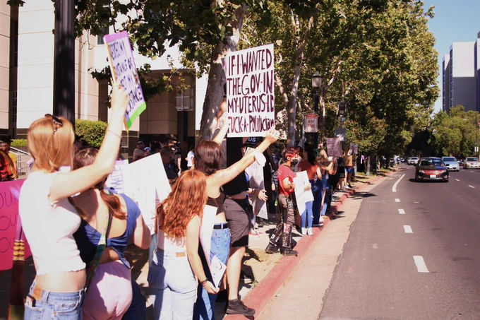 Dozens gather outside of the Robert Matsui Federal Courthouse to protest the U.S. Supreme Court ruling to overturn Roe v. Wade on June 24, 2022.