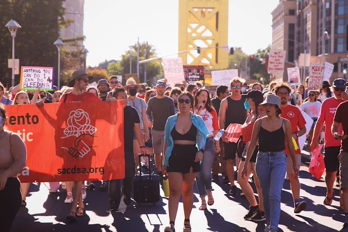 Dozens march through Sacramento to protest the U.S. Supreme Court ruling to overturn Roe v. Wade on June 24, 2022.