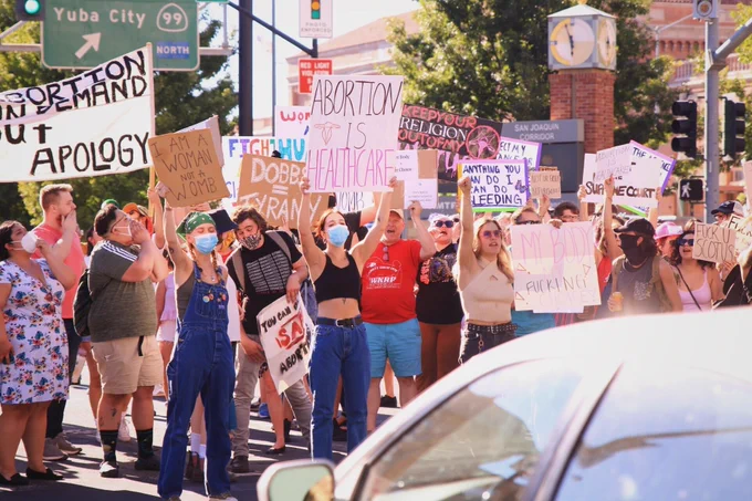 Dozens march through Sacramento to protest the U.S. Supreme Court ruling to overturn Roe v. Wade on June 24, 2022.
