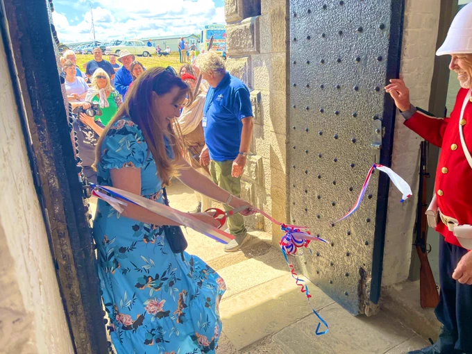 Kelly Tolhurst cutting the ribbon at Slough Fort to officially open the recently restored Guard Room