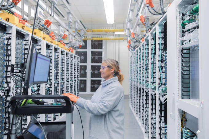 Woman working in a datacenter
