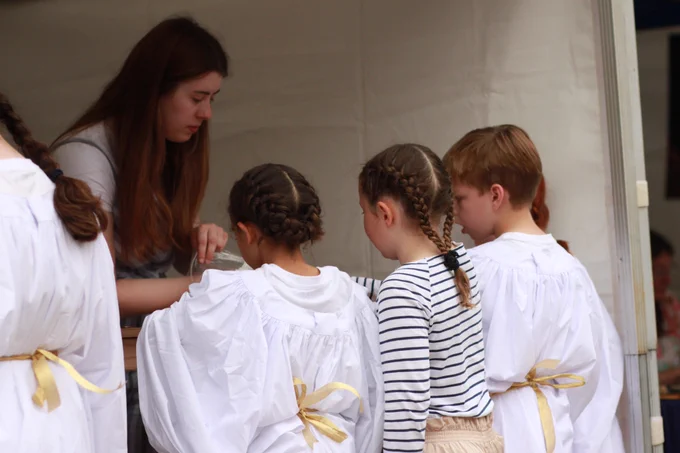 Pageant Choir learning craft skills at the Becket Pageant Livery Fair

