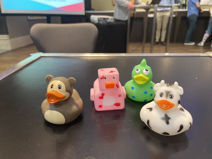 Plastic Ducks sit on a table