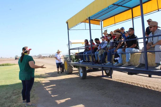 Farm Smart director Stacey Amparano explains how the acres of farmland used for research by the University of California Desert Research and Extension Center works during a tour on Thursday, June 16. | KATHERINE RAMOS PHOTO