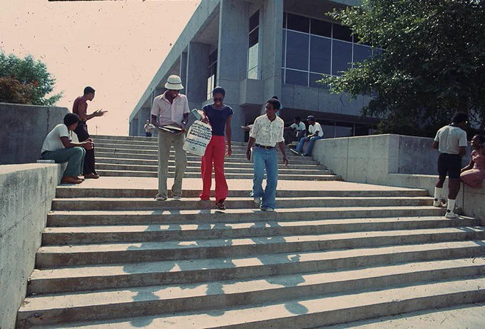 students hang out outside of Deitrick Hall