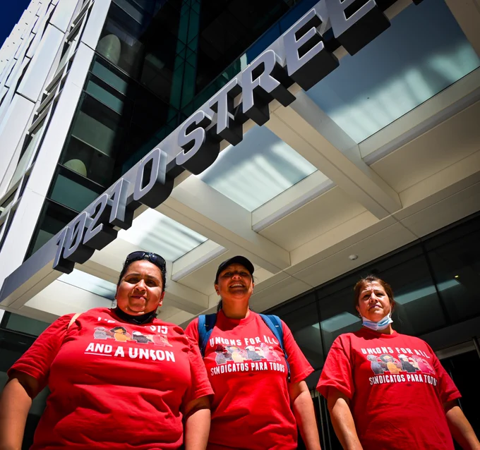 Dozens of fast food workers outside 1021 O Street, where hearings are heard in Sacramento 