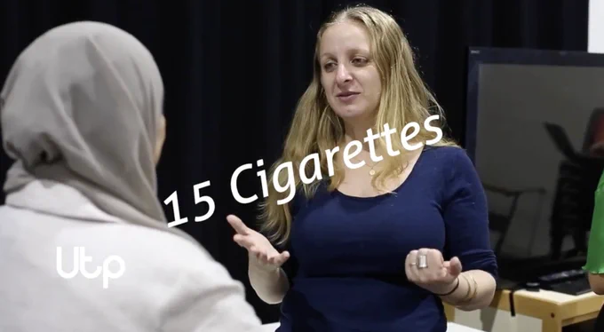 Image of Claudia Chidiac talking, she wears a blue shirt and her long blonde hair is out.