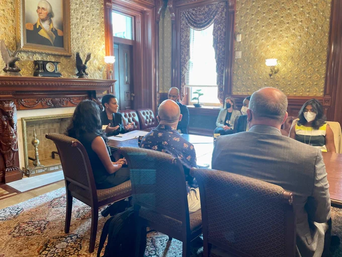 Dr. Alondra Nelson and Dr. Clarence Wardell speak with Presidential Innovation Fellows and US Digital Corps Fellows in a seminar room/table in the Eisenhower Executive Office Building. 