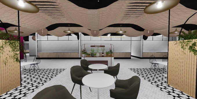 Photo shows a food hall interior with modern seating areas and a decorative flower table