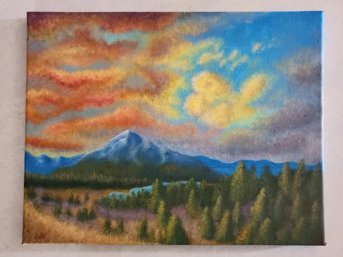An acrylic painting featuring clouds mountains and trees.