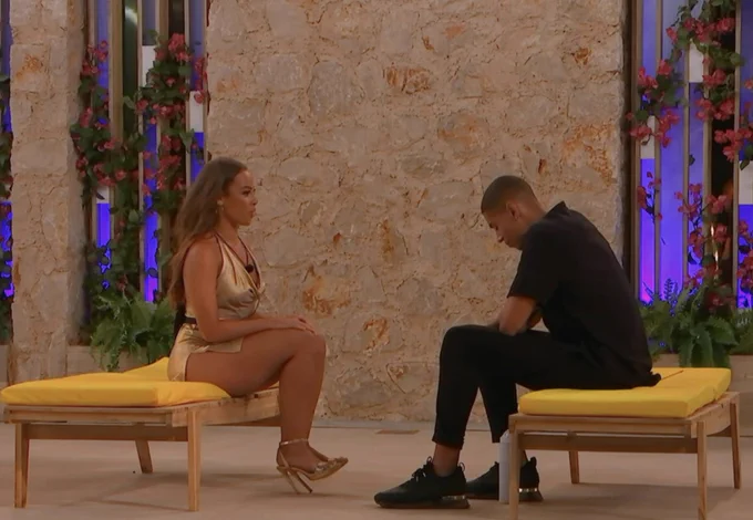 danica and josh sit opposite each other on separate sunbeds