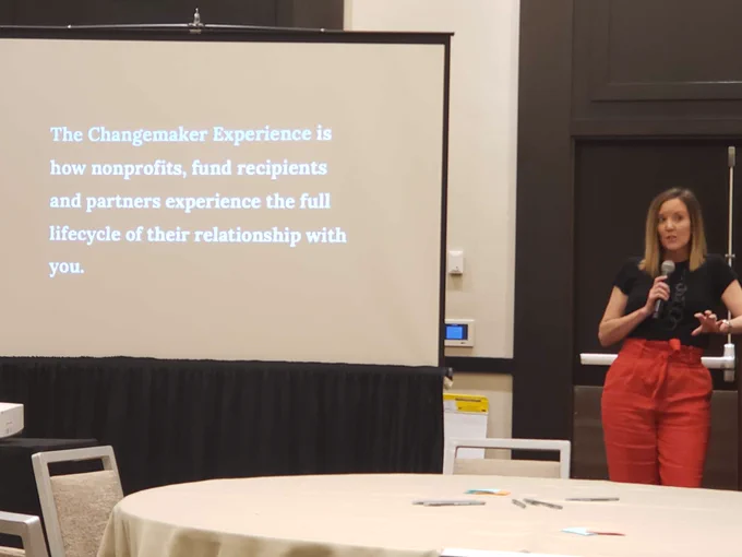 Chantal Forster presenting. The powerpoint reads "The Changemaker Experience is how nonprofits, fund recipients, and partners experience the full lifecycle of their relationship with you."