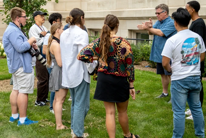 Students listen as instructor Bradley Wilson explains a photo technique at the Associated Collegiate Press Mega Workshop in Minneapolis July 16, 2022.