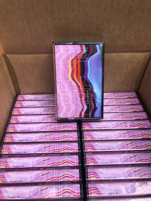 a bunch of Mute City cassettes in a cardboard box