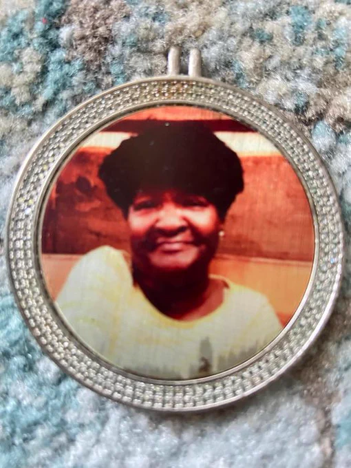 silver frame pendant. Beautiful older black woman in the image. Twitter, I need your help! This pendant was found in the sand on Rehoboth Beach DE the morning of July 17. This is someone's sister, mother, warrior, ancestor, or friend. I can tell by the framing, this person was loved. Help me find her please.