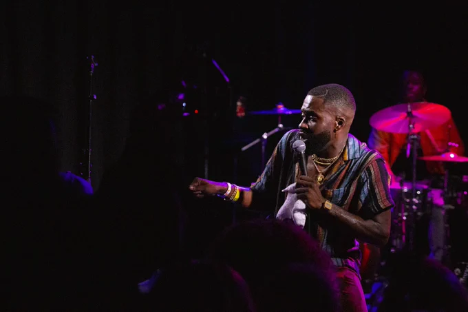 Obi dancing on stage.
