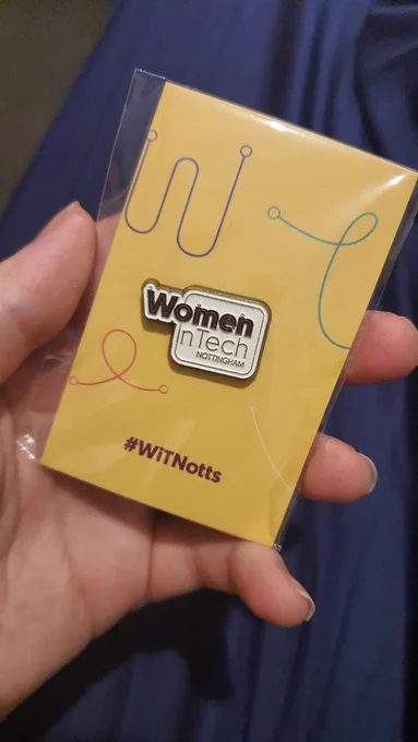 Pin badge with text reading "Women in Tech Nottingham". 