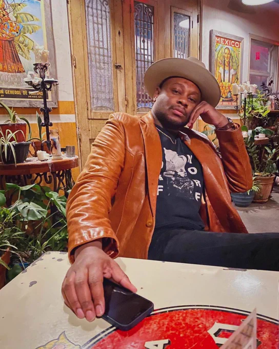 Writer Drew Blackburn in a hat and leather jacket