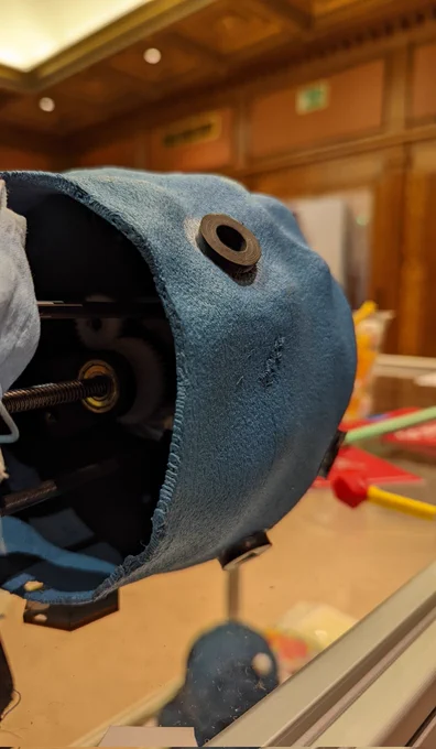 A 3d printed bacterium model with clockwork inner workings and holes on the outside that allows for the public to interact with them. The holes act as "receptors" for 3d printed viruses - when the right shape is inserted, this triggers the internal mechanism and changes the model's shape.