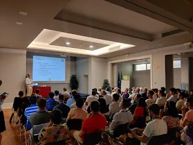 Koen De Bosschere introducing ACACES 2022 to a full room of participants